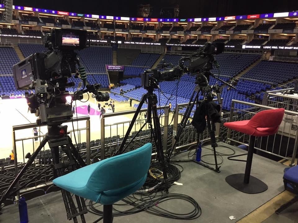 Broadcast cameras set up courtside before a live game
